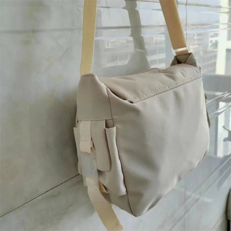 Large capacity student class crossbody canvas bag, women's versatile new Japanese Harajuku solid color mailman shoulder tote bag